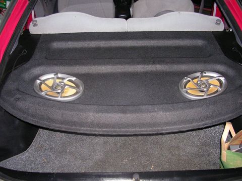 1996 Ford Probe - Rear deck speakers are visible in the interior of a car.