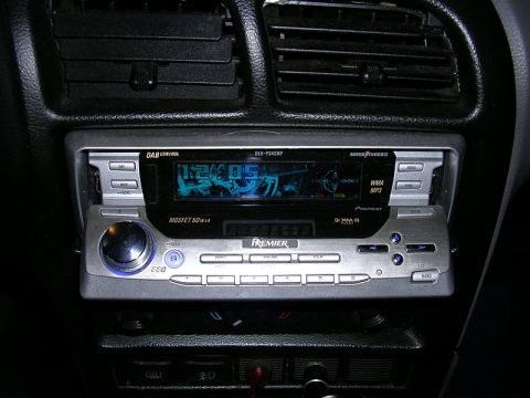 1996 Ford Probe - Close-up of a car's dashboard a Pioneer Premier car stereo system with a digital display and various control buttons.