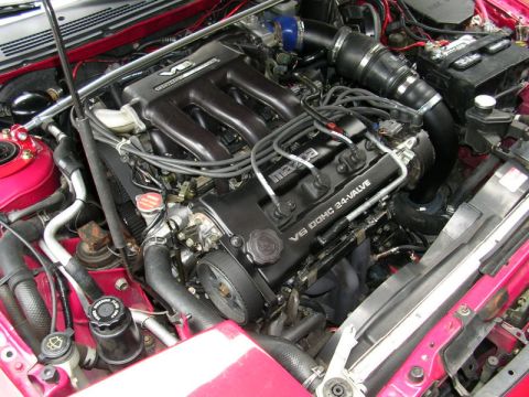 1996 Ford Probe - Engine bay view of a Mazda V6 DOHC 24-valve engine, likely from a Ford Probe.