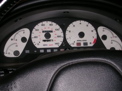 1996 Ford Probe - Dashboard of a 1996 Ford Probe showing the speedometer, tachometer, and other vital gauges.