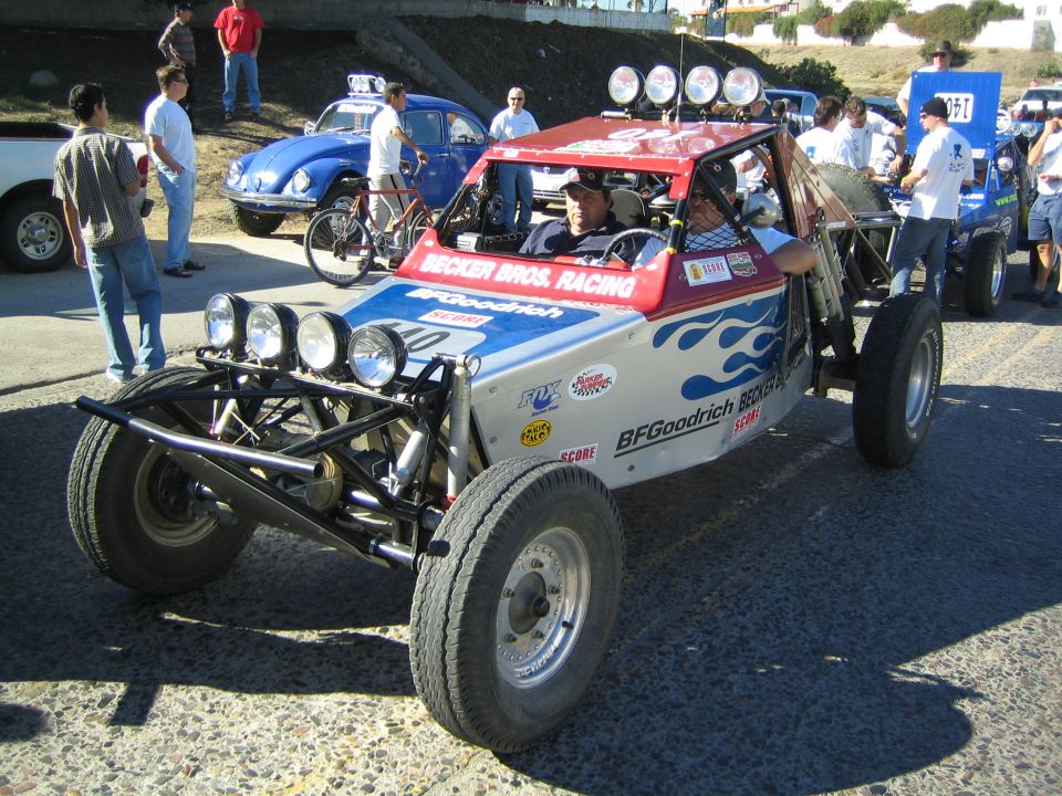 Red, white and blue off-road buggy lettered Becker Bros Racing and BFGoodrich with light bar