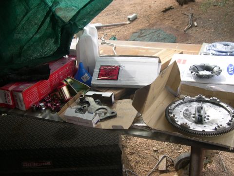 1997 Ford Probe - Various automotive parts, including a clutch kit and Gabriel shocks, are laid out on a table.