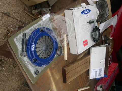 1997 Ford Probe - A new SPEC clutch kit and flywheel are laid out on a surface, ready for installation.