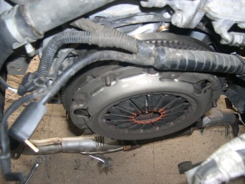 1997 Ford Probe - Close-up view of a vehicle's clutch assembly, showing mechanical components and wiring.