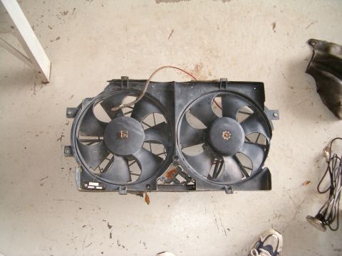 1991 Ford Bronco - Dual radiator fans are shown mounted on a black plastic shroud.