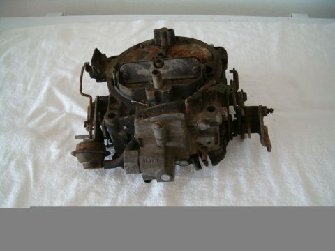 1991 Ford Bronco - This carburetor shows signs of wear and rust, with the word "FILTER" visible on its casing.