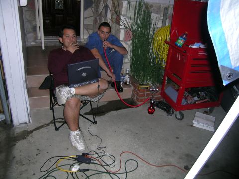1993 Ford Probe - Two men are relaxing outdoors with hookahs and a laptop, with a red toolbox nearby.