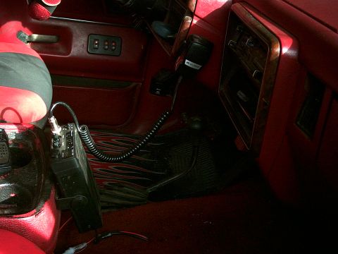 1988 Ford Bronco - This photo shows the interior of a vehicle, focusing on the installation of a CB radio and its accessories.