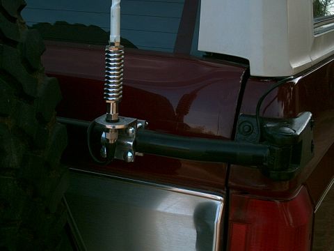 1988 Ford Bronco - A CB antenna is mounted to the spare tire carrier on the rear of a 1988 Ford Bronco.