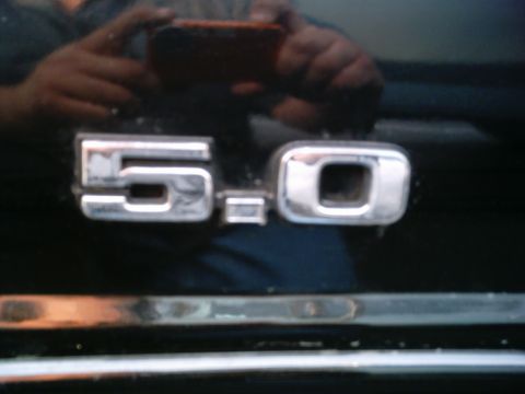 1986 Ford Bronco - Close-up of a 5.0 liter engine badge, likely from a Ford vehicle.