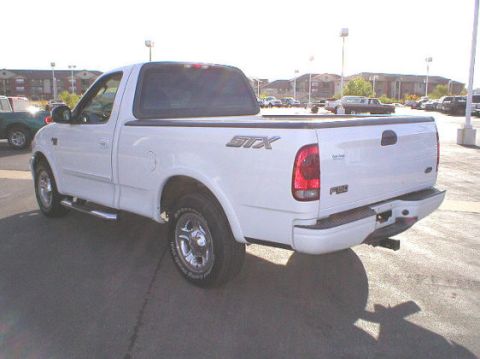 2003 Ford F-150 - This 2003 Ford F-150 STX pickup truck is shown from the rear 3/4 angle.