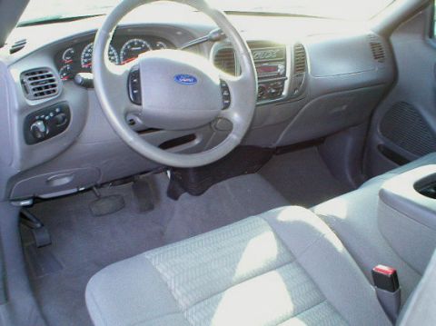 2003 Ford F-150 - Interior view of a 2003 Ford F-150, highlighting the dashboard and seating area.