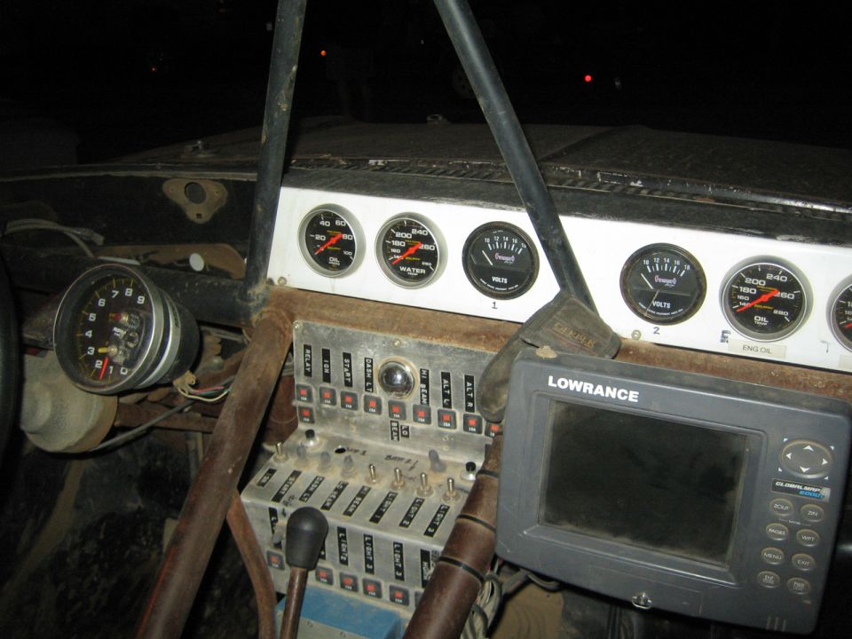 Race truck interior dash with Auto Meter gauges and a Lowrance GPS unit