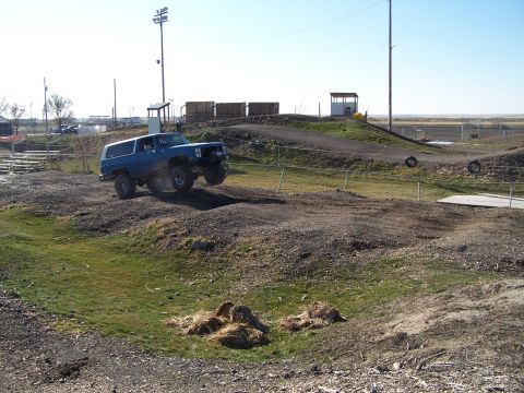 1979 Ford Bronco - This 1979 Ford Bronco is captured mid-air while navigating an off-road course.