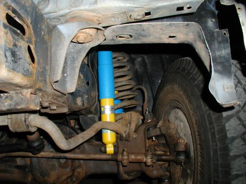 1986 Ford Bronco - Undercarriage view of a 1986 Ford Bronco, highlighting a recently installed Bilstein shock absorber.