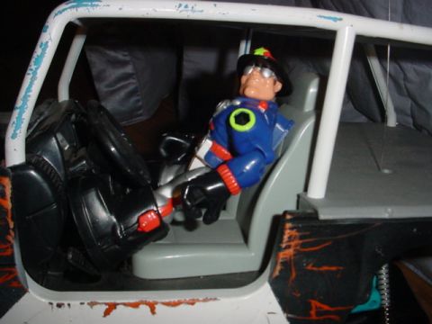 1988 Ford Bronco - Toy RC car interior shows an action figure in the driver's seat.
