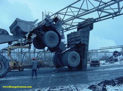 1989 Ford Bronco - An overturned industrial vehicle dominates the scene, with a white SUV visible in the distance.