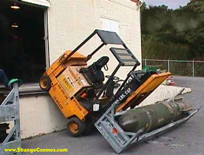 1989 Ford Bronco - Forklift carrying a bomb has tipped over near a building entrance.