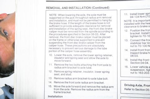 1994 Ford Bronco - A page from a vehicle repair manual detailing axle removal and installation procedures.