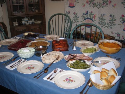 2004 Ford F-150 - A festive Thanksgiving dinner spread is laid out on a blue tablecloth, ready to be enjoyed.