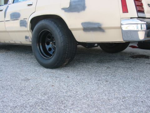 1985 Ford LTD Crown Victoria - Rear view of a 1985 Ford Crown Victoria LTD, highlighting the wheel and fender area.