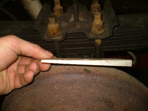 1989 Ford Bronco - Installing a shim on the rear differential housing.