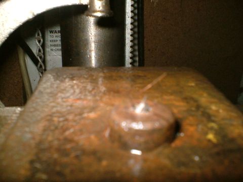 1989 Ford Bronco - Close-up of a machine part with a warning label visible in the background.
