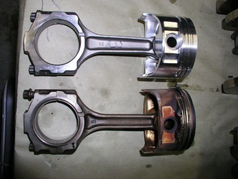 1996 Ford Probe - Comparison of a new piston and connecting rod assembly with a used one.