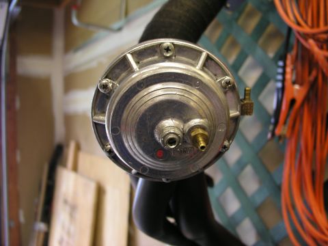 1996 Ford Probe - A turbo blow-off valve is shown, likely part of a vehicle's engine system, in a workshop environment.