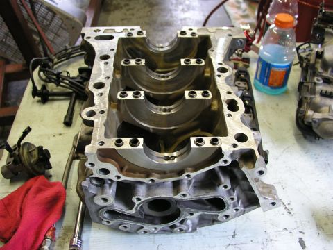 1996 Ford Probe - Engine block disassembled on a workbench, ready for rebuild.