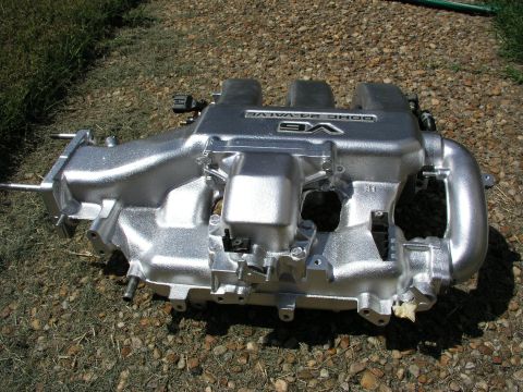 1996 Ford Probe - Silver intake manifold with V6 DOHC 24-VALVE markings, likely for a performance engine rebuild.