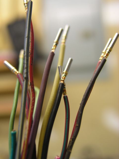 1996 Ford Probe - Close-up of various electrical wires, each prepared with a metal connector for electrical connection.
