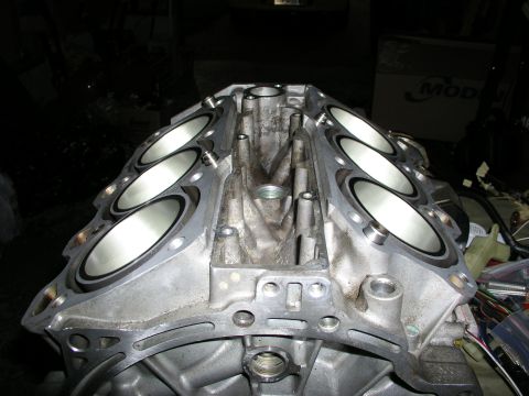 1996 Ford Probe - Close-up view of an engine block, focusing on the cylinder bores and internal structure.
