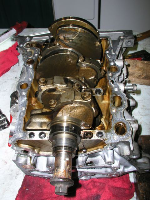 1996 Ford Probe - Disassembled engine block with crankshaft visible, indicating a repair or rebuild process.
