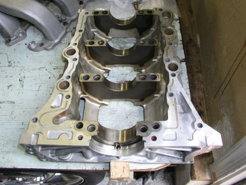 1996 Ford Probe - Close-up of an engine block, showing the main bearing saddles and some attached components.