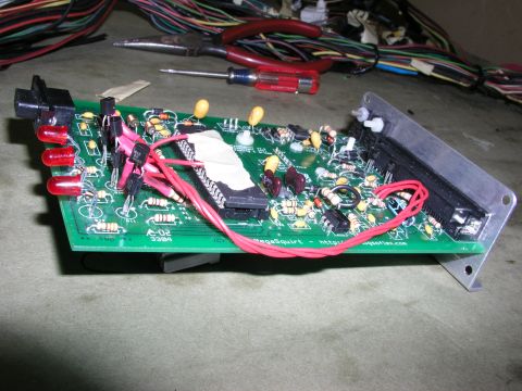 1996 Ford Probe - An electronic circuit board, possibly for a vehicle, is shown with various components and wiring.