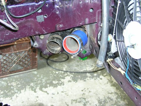 1996 Ford Probe - Close-up of engine bay components, including a blue silicone hose and metal piping.