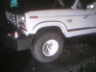1986 Ford Bronco - Front view of a 1986 Ford Bronco, showing the grille and fender.