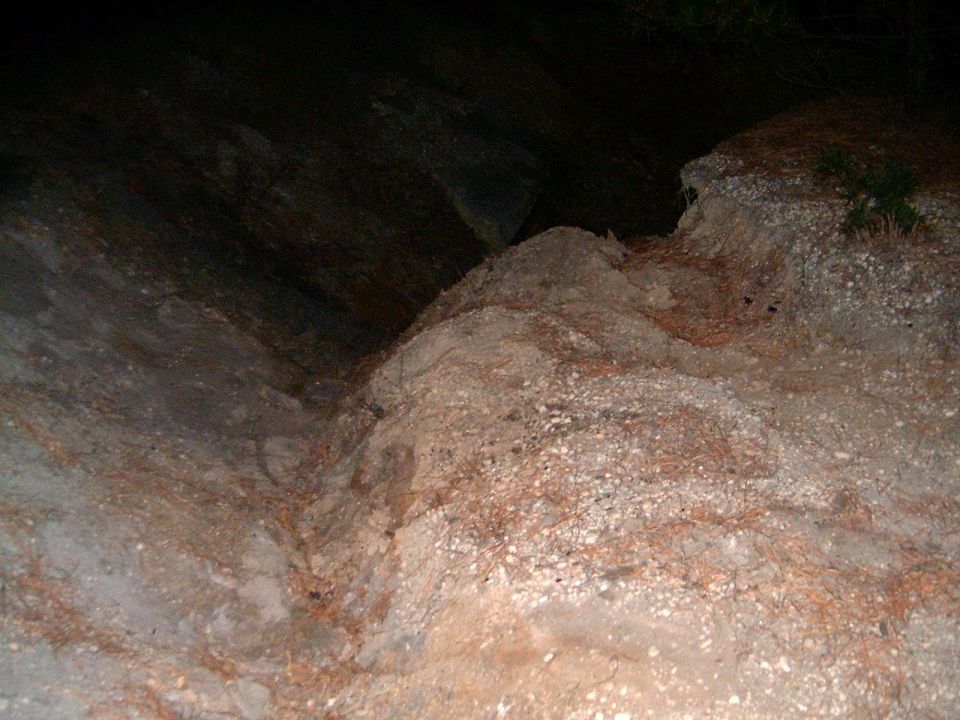 rocky ground with some sparse vegetation