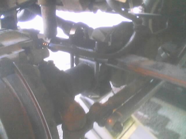 Underside view of a vehicle's suspension and axle components