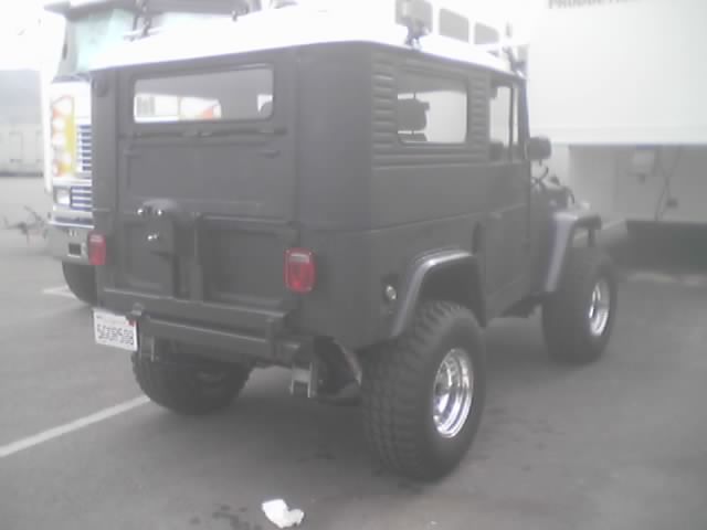 Rear of a gray Toyota Land Cruiser FJ40 in a parking lot