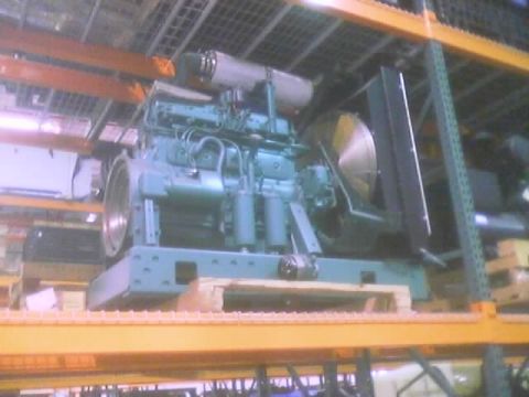 1968 Ford Mustang - Industrial engine unit on a wooden pallet, stored on warehouse shelving.
