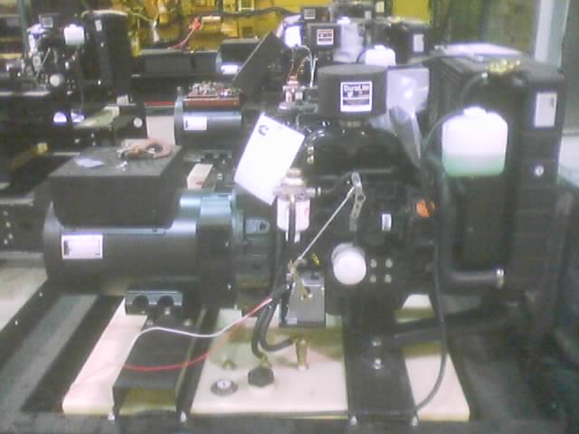 Black industrial engine with a white label and a clear fluid reservoir