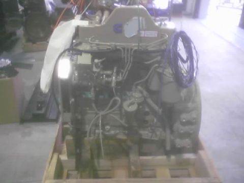 1968 Ford Mustang - This is an engine unit, likely for marine or industrial use, mounted on a wooden pallet for transport or storage.