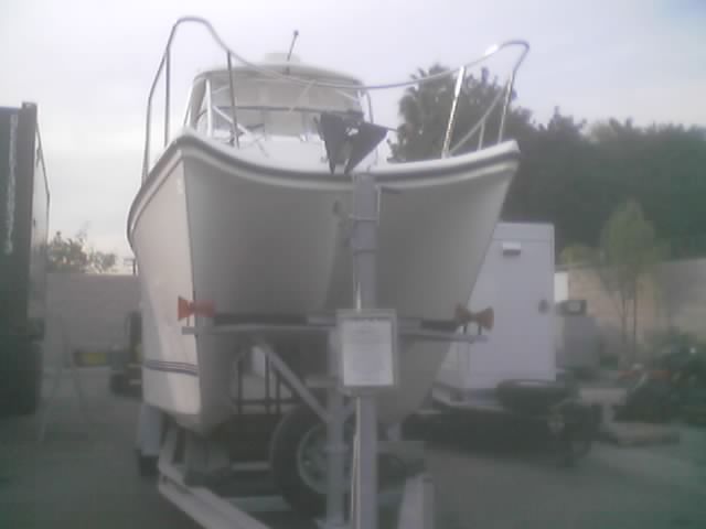 White boat on a trailer, viewed from the rear