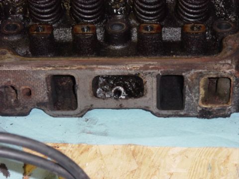 1991 Ford Bronco - I love all the semi-solidified sludge in the manifold bolt pockets. Three out of four were full. No idea how -- this should be a sealed-off…