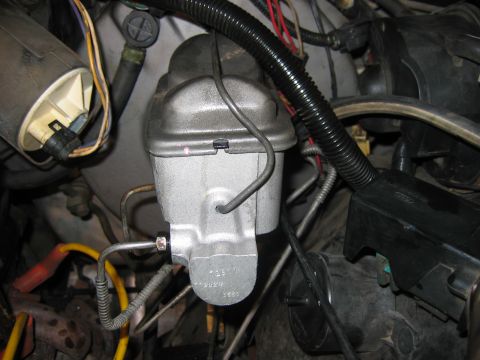 1985 Ford LTD Crown Victoria - Close-up view of a master cylinder, showing part numbers for identification.