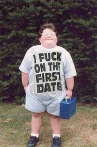 1986 Ford Bronco - A child stands outdoors wearing a t-shirt with provocative text and holding a blue lunchbox.