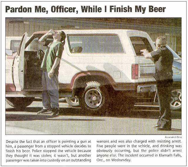 Newspaper clipping showing a white 1980s SUV at a police traffic stop