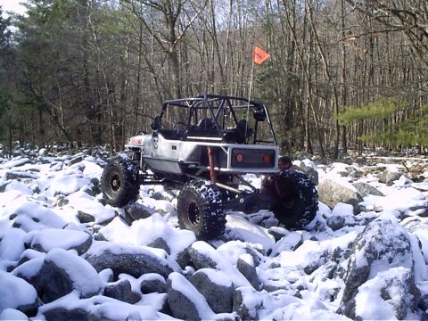 1989 Ford F-350 - Custom off-road buggy navigating a rocky trail covered in snow.